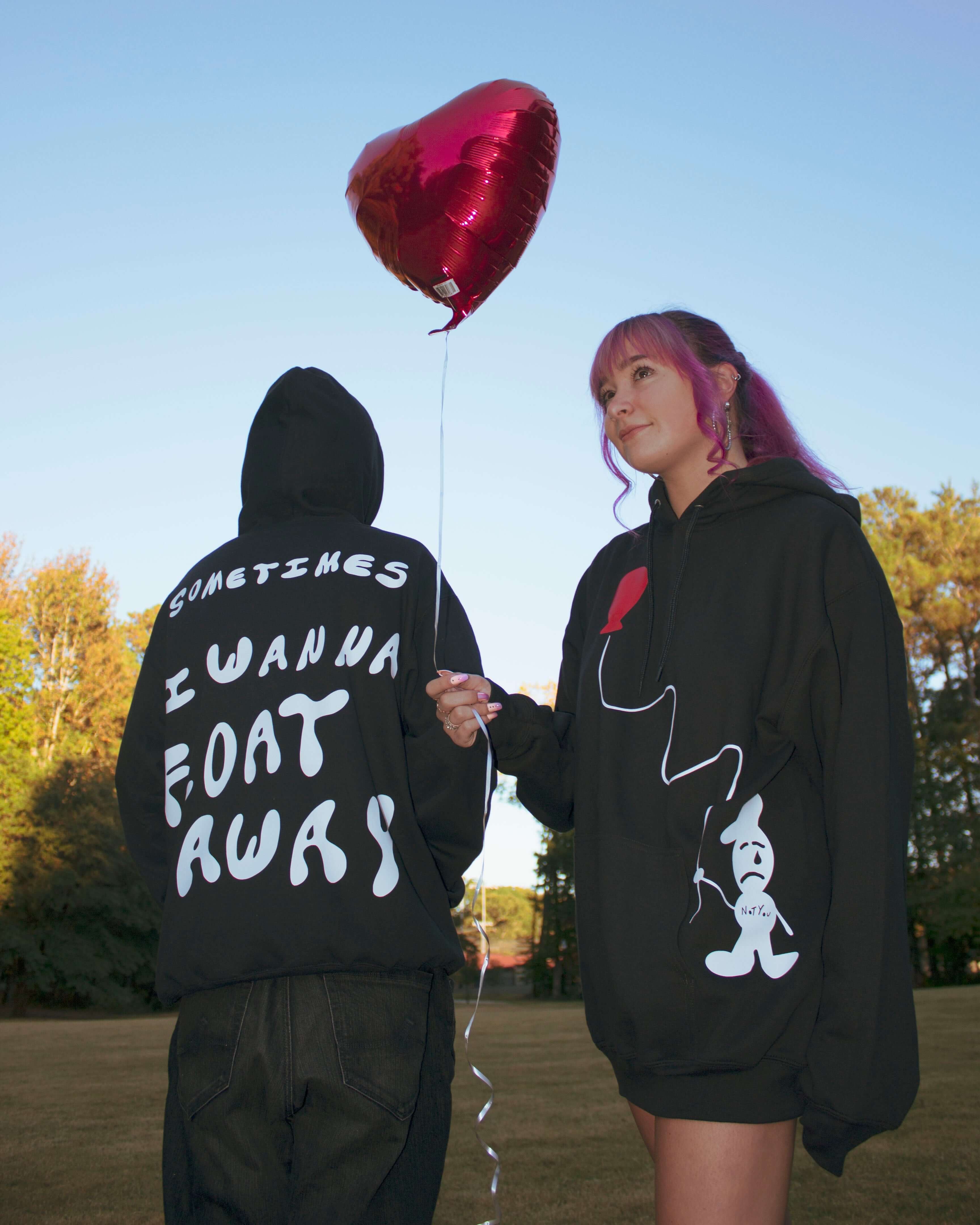 Model Picture wearing "Float Away" Black Hoodie