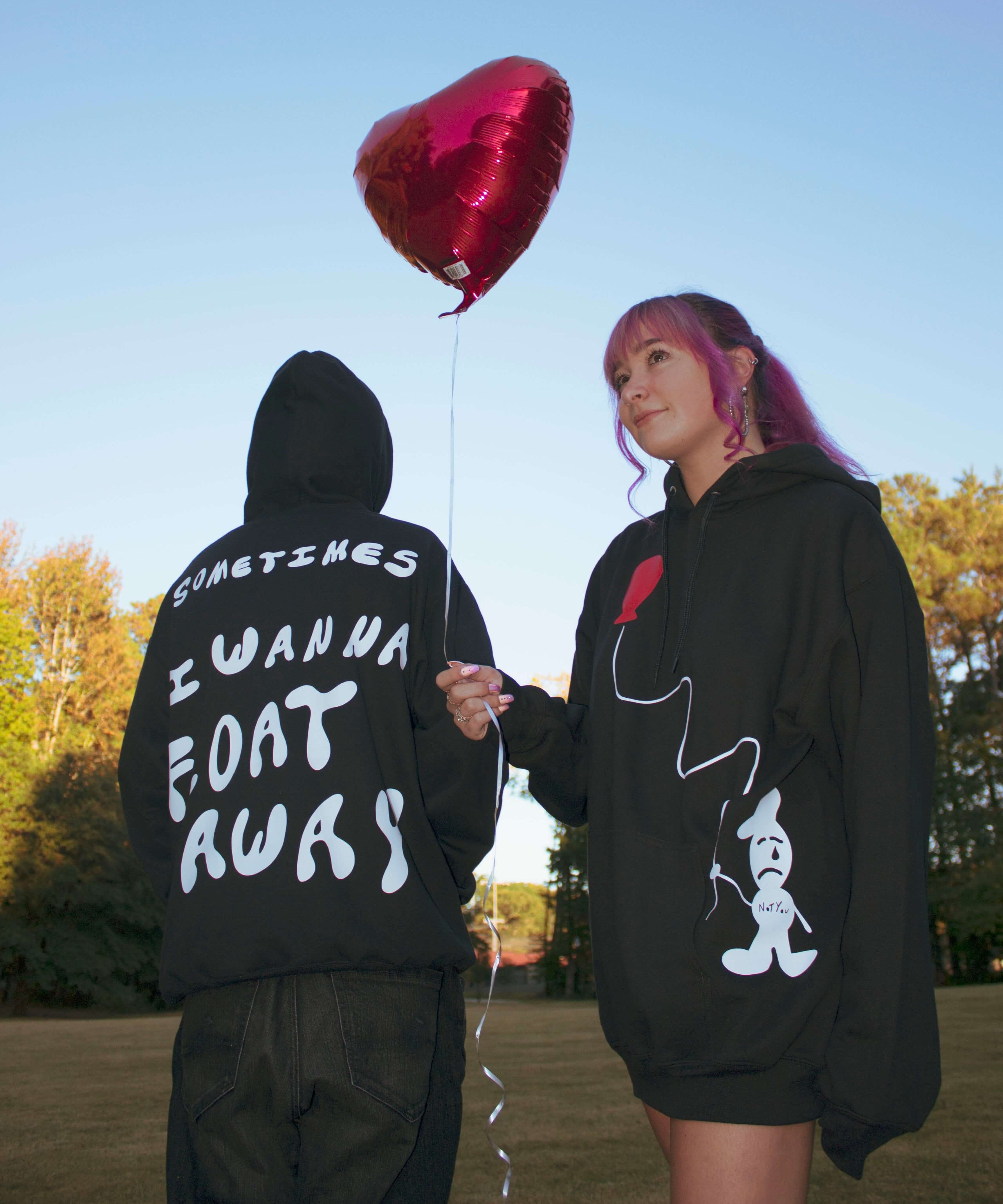 Model Picture wearing "Float Away" Black Hoodie