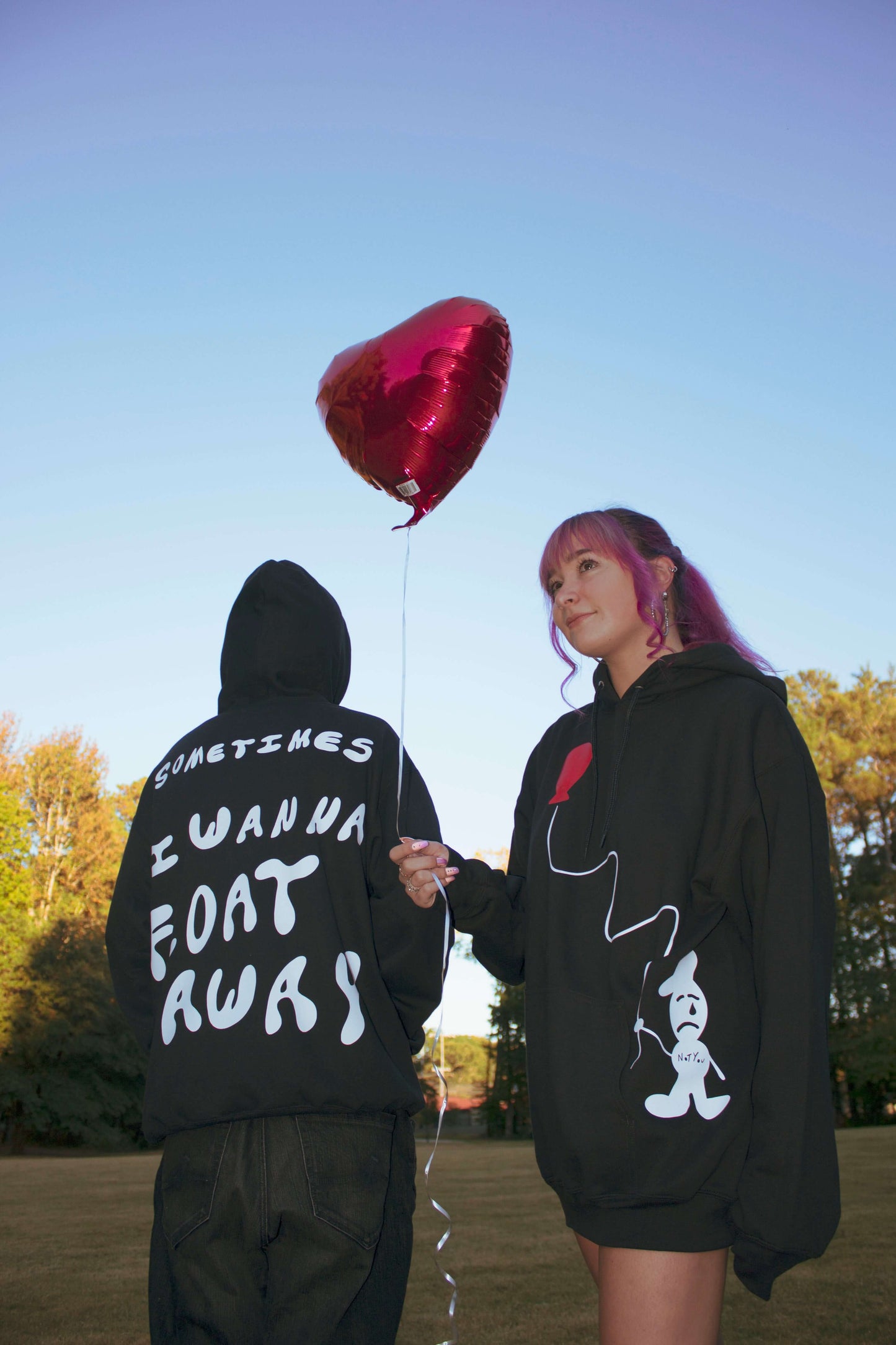 Model Picture wearing "Float Away" Black Hoodie